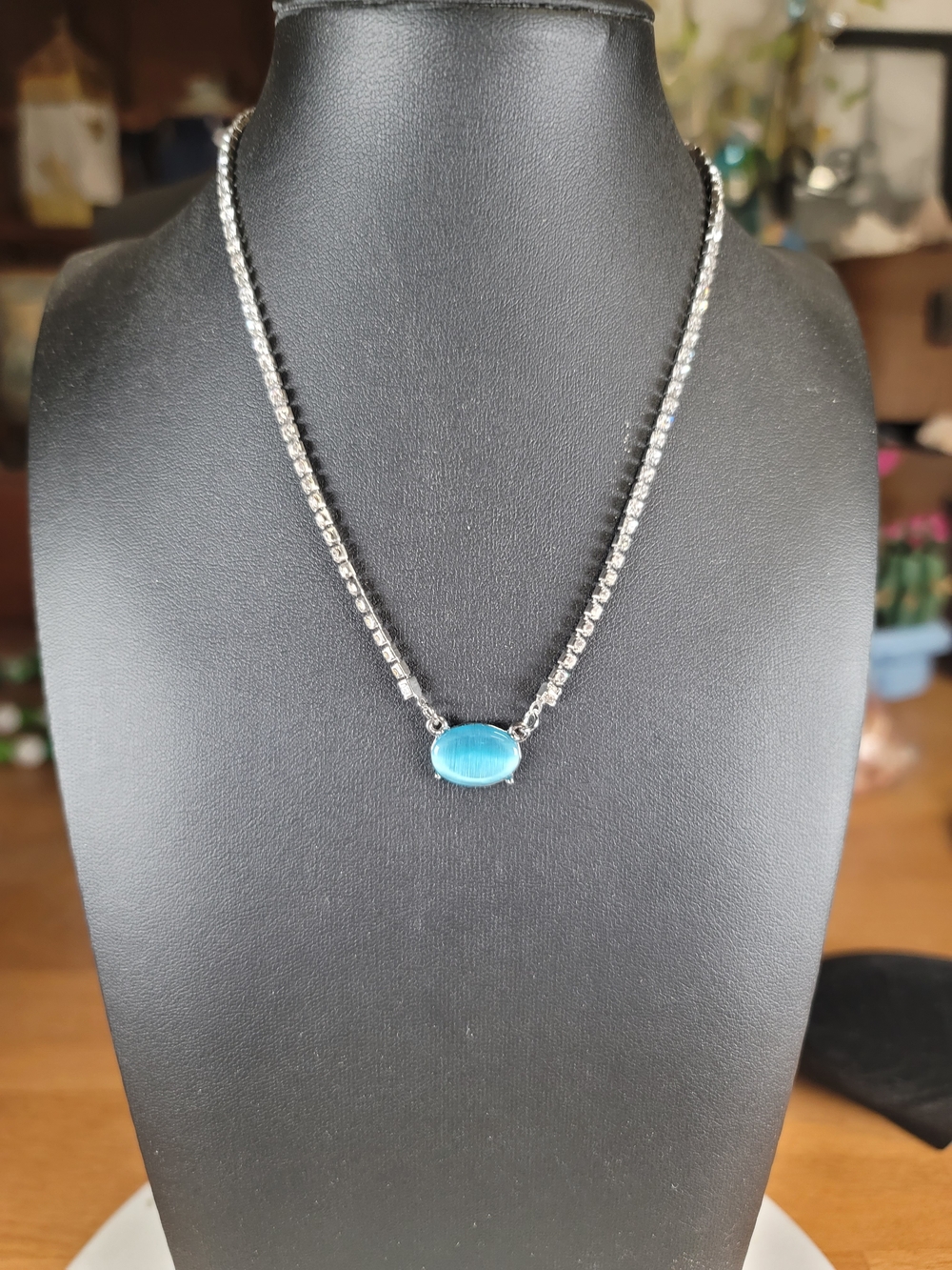 paparazzi Silver Rhinestone Necklace with Bright Blue Oval Cat's Eye Stone
